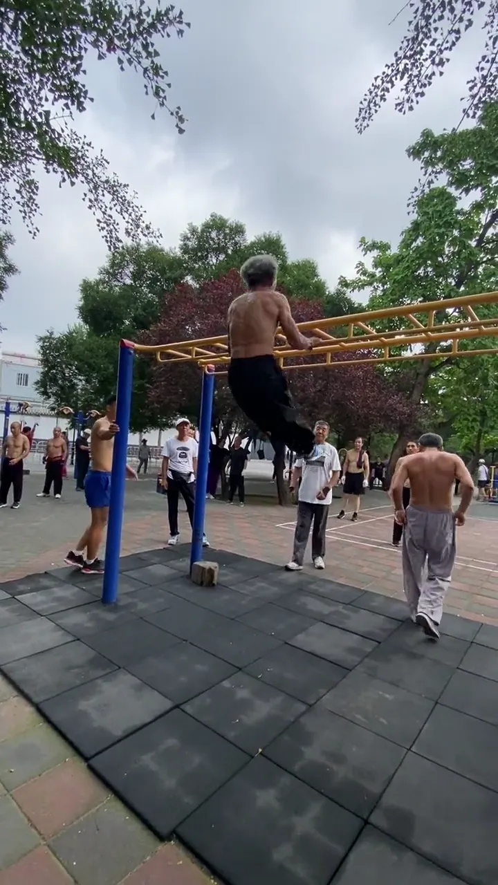 Elderly acrobat performing stunning park stunts that defy age and expectation