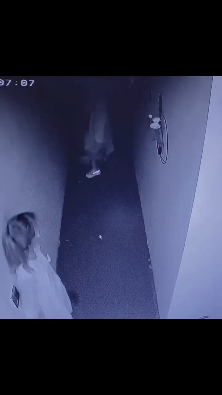 People screaming and running through a haunted house with over-the-top reactions