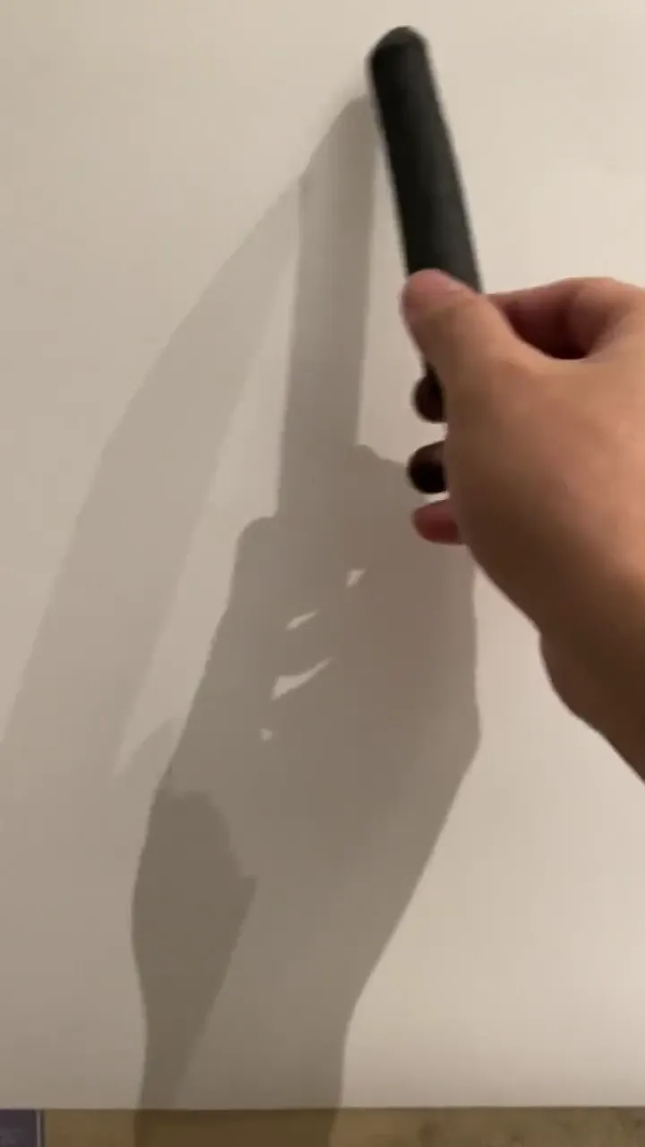 Artist using unconventional tools to create a stunning painting