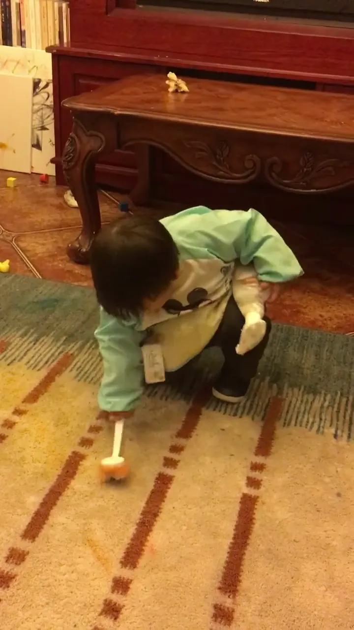 Modern dad using unconventional methods to calm a crying baby