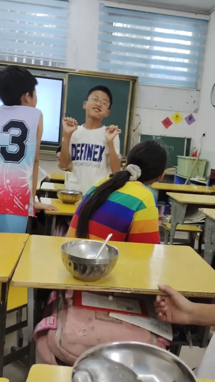 Teacher walking into a classroom to find students pulling a funny surprise